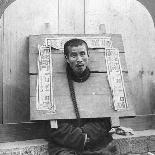 Feeding a Prisoner Wearing a Cangue, China, 1902-CH Graves-Photographic Print