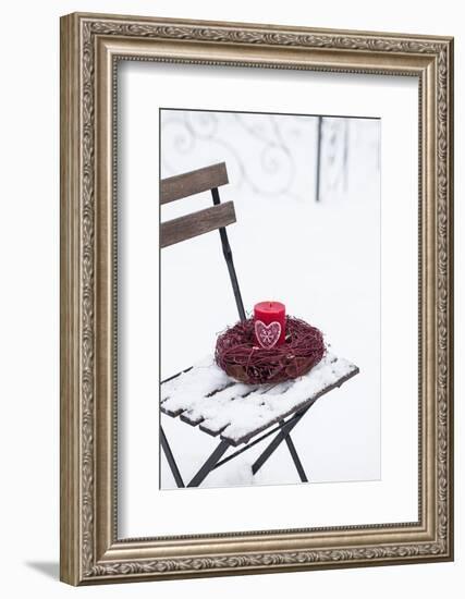 Chair in the Snow with Candle and Wreath-Andrea Haase-Framed Photographic Print