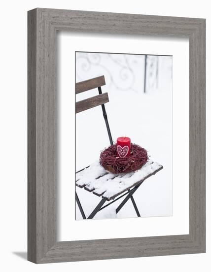 Chair in the Snow with Candle and Wreath-Andrea Haase-Framed Photographic Print