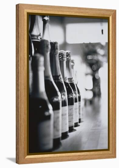 Champagne Bottles in a Row-Walter Bibikow-Framed Premier Image Canvas