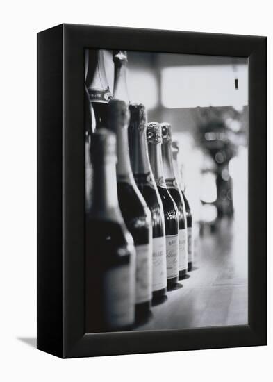 Champagne Bottles in a Row-Walter Bibikow-Framed Premier Image Canvas