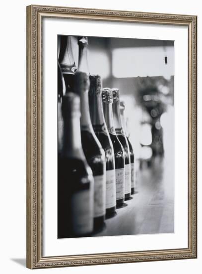 Champagne Bottles in a Row-Walter Bibikow-Framed Photographic Print