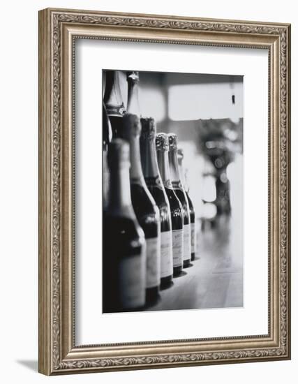 Champagne Bottles in a Row-Walter Bibikow-Framed Photographic Print