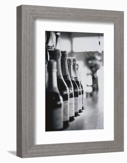 Champagne Bottles in a Row-Walter Bibikow-Framed Photographic Print