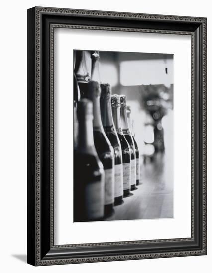 Champagne Bottles in a Row-Walter Bibikow-Framed Photographic Print