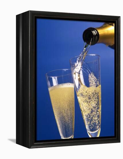 Champagne glass and bottle-null-Framed Premier Image Canvas