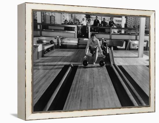 Champion Bowler Andy Varipapa Demonstrating Favorite Trick of Rolling Two Balls Down Alley at once-Gjon Mili-Framed Premier Image Canvas
