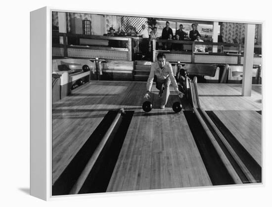 Champion Bowler Andy Varipapa Demonstrating Favorite Trick of Rolling Two Balls Down Alley at once-Gjon Mili-Framed Premier Image Canvas