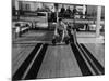 Champion Bowler Andy Varipapa Demonstrating Favorite Trick of Rolling Two Balls Down Alley at once-Gjon Mili-Mounted Premium Photographic Print