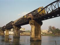 Train Crossing the River Kwai Bridge at Kanchanburi in Thailand, Southeast Asia-Charcrit Boonsom-Photographic Print