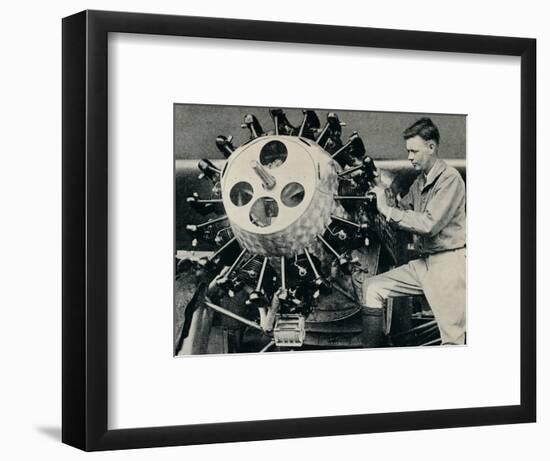 Charles Lindbergh checking the engine of his aircraft before his transatlantic flight, 1927-Unknown-Framed Photographic Print