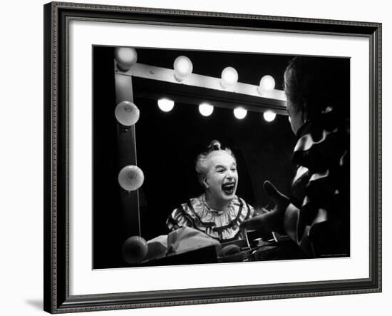 Charlie Chaplin at Dressing Room Mirror, Giving Himself a Wide Grin-W^ Eugene Smith-Framed Premium Photographic Print