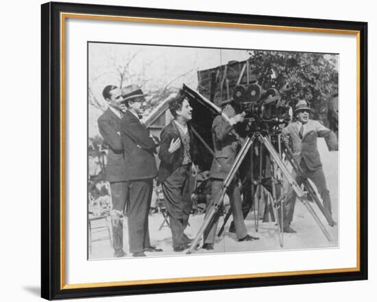 Charlie Chaplin Laughing During Shooting of Film-null-Framed Premium Photographic Print