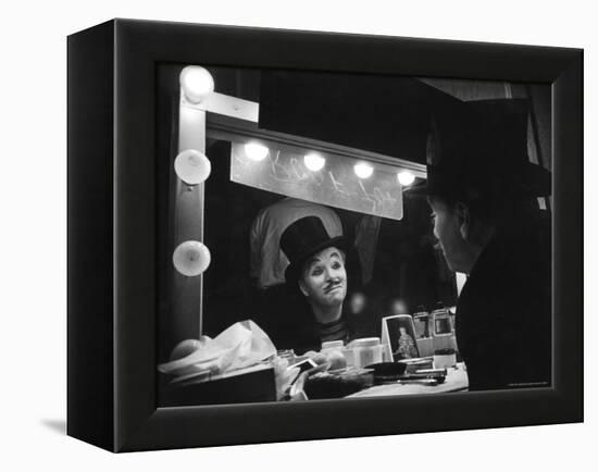 Charlie Chaplin Looking Into Mirror, Putting on Makeup for Role as the Animal Trainer-W^ Eugene Smith-Framed Premier Image Canvas