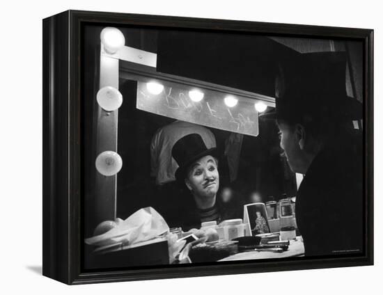 Charlie Chaplin Looking Into Mirror, Putting on Makeup for Role as the Animal Trainer-W^ Eugene Smith-Framed Premier Image Canvas