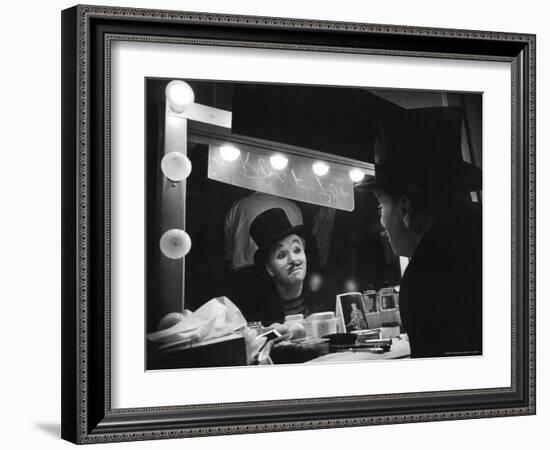 Charlie Chaplin Looking Into Mirror, Putting on Makeup for Role as the Animal Trainer-W^ Eugene Smith-Framed Premium Photographic Print
