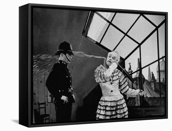 Charlie Chaplin Squirting Water Into Face of Policeman, Scene from Limelight-W^ Eugene Smith-Framed Premier Image Canvas