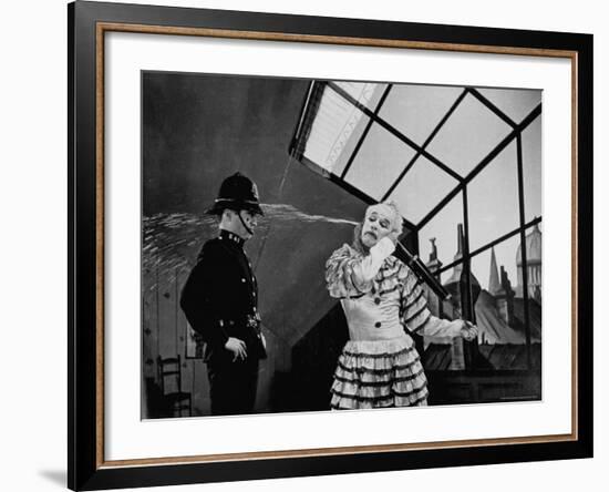 Charlie Chaplin Squirting Water Into Face of Policeman, Scene from Limelight-W^ Eugene Smith-Framed Premium Photographic Print