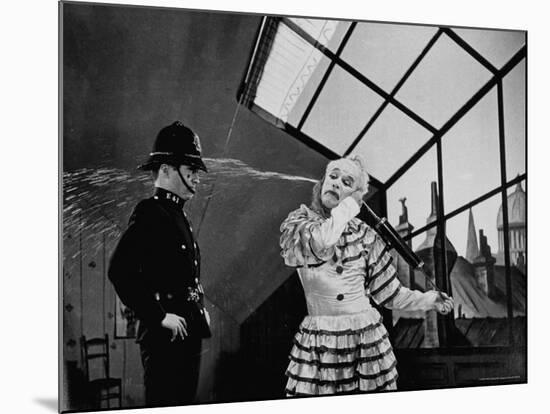 Charlie Chaplin Squirting Water Into Face of Policeman, Scene from Limelight-W^ Eugene Smith-Mounted Premium Photographic Print