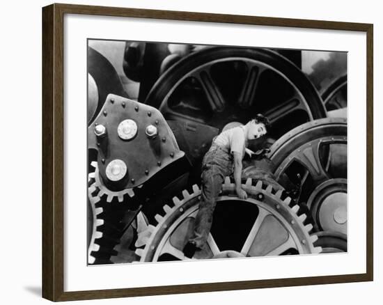 Charlie Chaplin. "The Masses" 1936, "Modern Times" Directed by Charles Chaplin-null-Framed Photographic Print