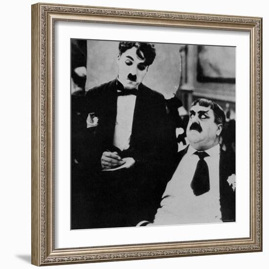 Charlie Chaplin with Eric Campbell in The Rink-null-Framed Premium Photographic Print