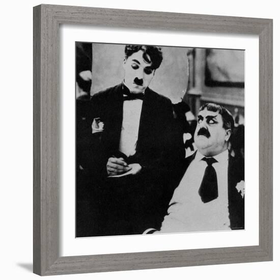 Charlie Chaplin with Eric Campbell in The Rink-null-Framed Premium Photographic Print