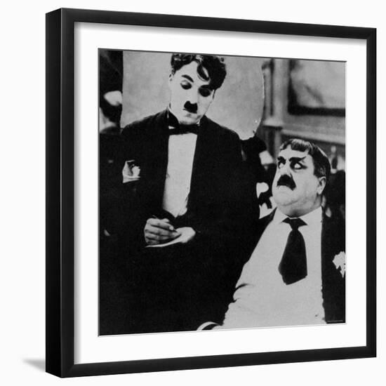 Charlie Chaplin with Eric Campbell in The Rink-null-Framed Premium Photographic Print