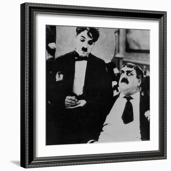 Charlie Chaplin with Eric Campbell in The Rink-null-Framed Premium Photographic Print