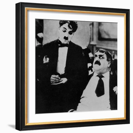 Charlie Chaplin with Eric Campbell in The Rink-null-Framed Premium Photographic Print