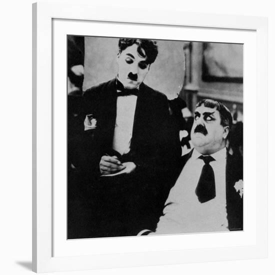 Charlie Chaplin with Eric Campbell in The Rink-null-Framed Premium Photographic Print