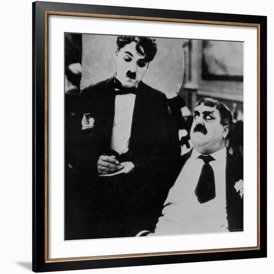 Charlie Chaplin with Eric Campbell in The Rink-null-Framed Premium Photographic Print