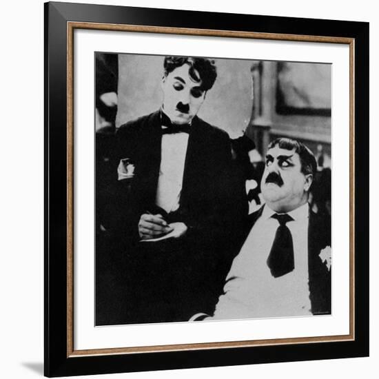 Charlie Chaplin with Eric Campbell in The Rink-null-Framed Premium Photographic Print