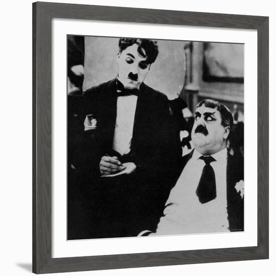 Charlie Chaplin with Eric Campbell in The Rink-null-Framed Premium Photographic Print