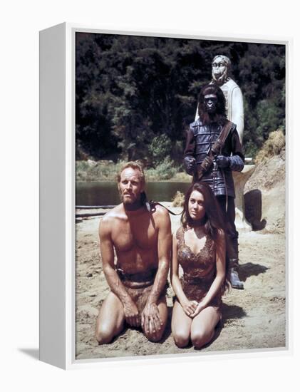 Charlton Heston; Linda Harrison. "Planet of the Apes" [1968], Directed by Franklin J. Schaffner.-null-Framed Premier Image Canvas