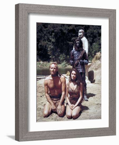 Charlton Heston; Linda Harrison. "Planet of the Apes" [1968], Directed by Franklin J. Schaffner.-null-Framed Photographic Print