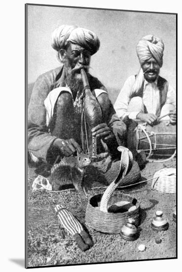 Charming the Venom from a Cobra; a Snake Charmer with a Mongoose, India, 1922-JH Reverend Powell-Mounted Giclee Print