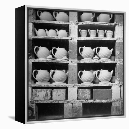 Cheap Chinaware Saucers, Cups, Teapots, Etc Standing on Racks in Pottery of the Hall China Co-Walker Evans-Framed Premier Image Canvas