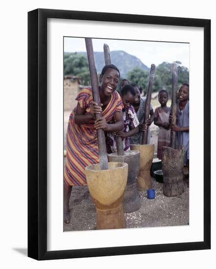 Cheerful Young Girls Pound Corn Outside Families' Homes Near Monkey Bay, South End of Lake Malawi-Nigel Pavitt-Framed Photographic Print