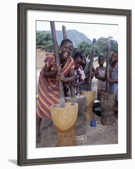 Cheerful Young Girls Pound Corn Outside Families' Homes Near Monkey Bay, South End of Lake Malawi-Nigel Pavitt-Framed Photographic Print