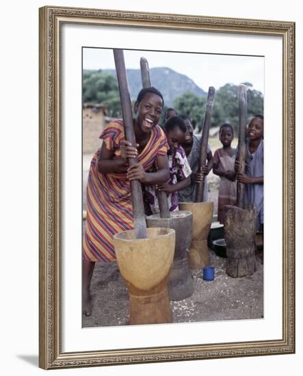 Cheerful Young Girls Pound Corn Outside Families' Homes Near Monkey Bay, South End of Lake Malawi-Nigel Pavitt-Framed Photographic Print
