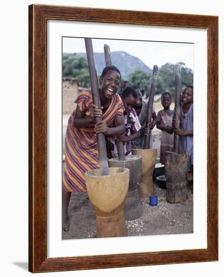 Cheerful Young Girls Pound Corn Outside Families' Homes Near Monkey Bay, South End of Lake Malawi-Nigel Pavitt-Framed Photographic Print