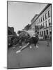 Cheerleaders Parading Prior to a Football Game Between Queens College and the University of Toronto-Lisa Larsen-Mounted Photographic Print