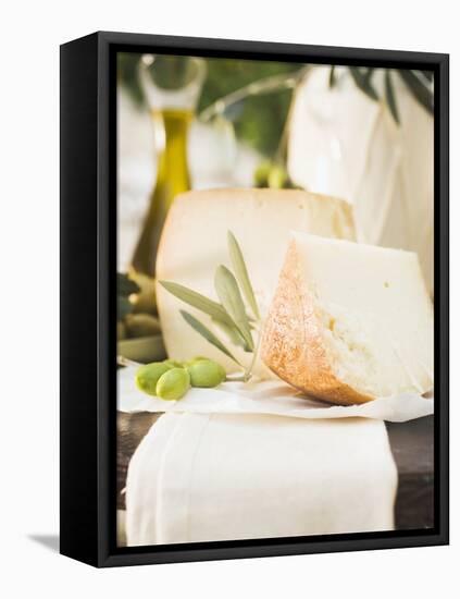 Cheese, Green Olives and Olive Oil on Table Out of Doors-null-Framed Premier Image Canvas