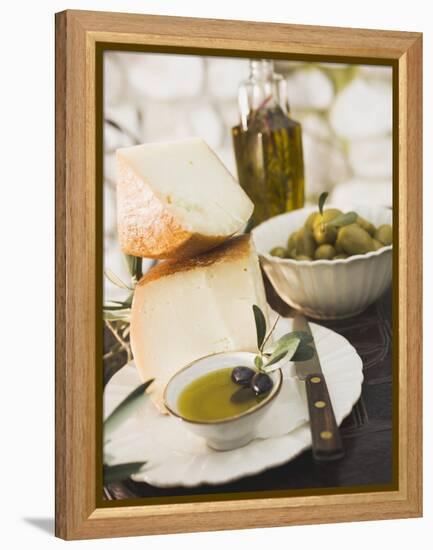 Cheese, Olives and Olive Oil on Table Out of Doors-null-Framed Premier Image Canvas