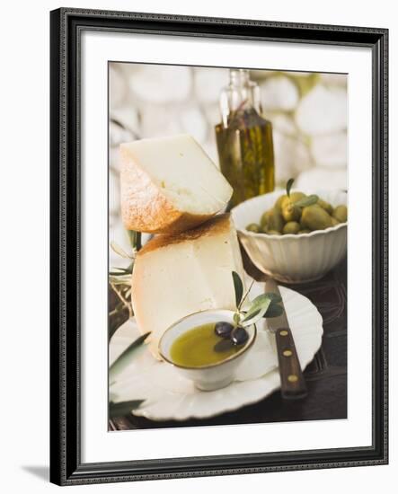 Cheese, Olives and Olive Oil on Table Out of Doors-null-Framed Photographic Print