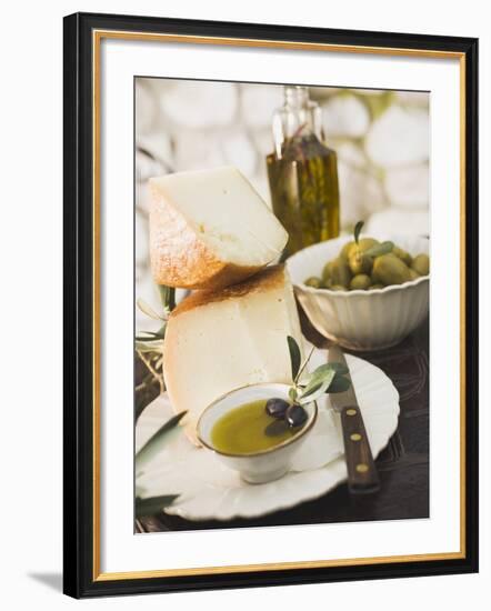 Cheese, Olives and Olive Oil on Table Out of Doors-null-Framed Photographic Print