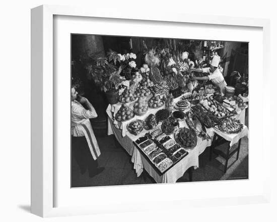 Chef Domenico Giving Final Touch to Magnificent Display of Food on Table at Passeto Restaurant-Alfred Eisenstaedt-Framed Photographic Print