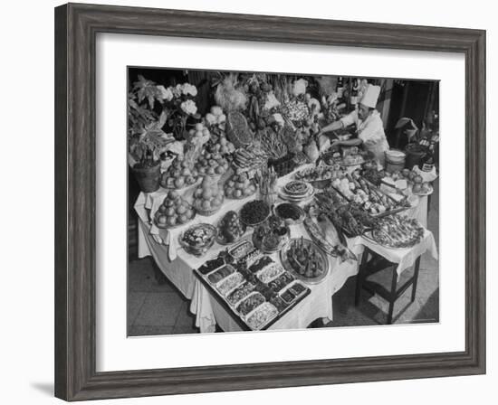 Chef Domenico Giving Final Touch to Magnificent Display of Food on Table at Passeto Restaurant-Alfred Eisenstaedt-Framed Photographic Print