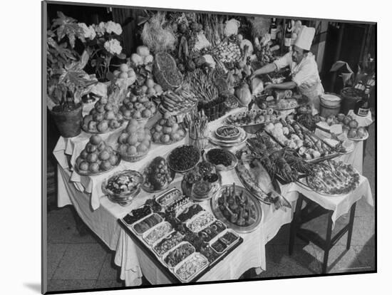 Chef Domenico Giving Final Touch to Magnificent Display of Food on Table at Passeto Restaurant-Alfred Eisenstaedt-Mounted Photographic Print