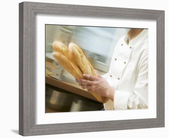 Chef Hurrying Through Kitchen with Baguettes-null-Framed Photographic Print